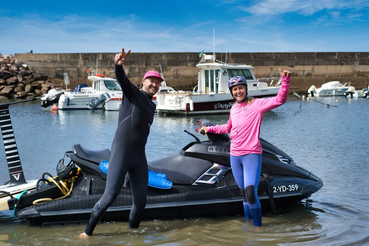 Two of the crew celebrating with the jetski in the harbor